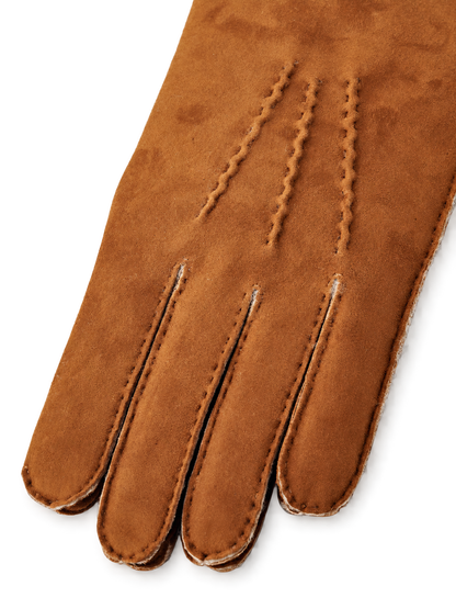 Hestra Bernard cork stitching detail, AI-edited background