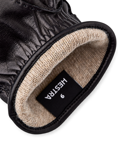 Hestra Jake black lining detail, AI-edited background