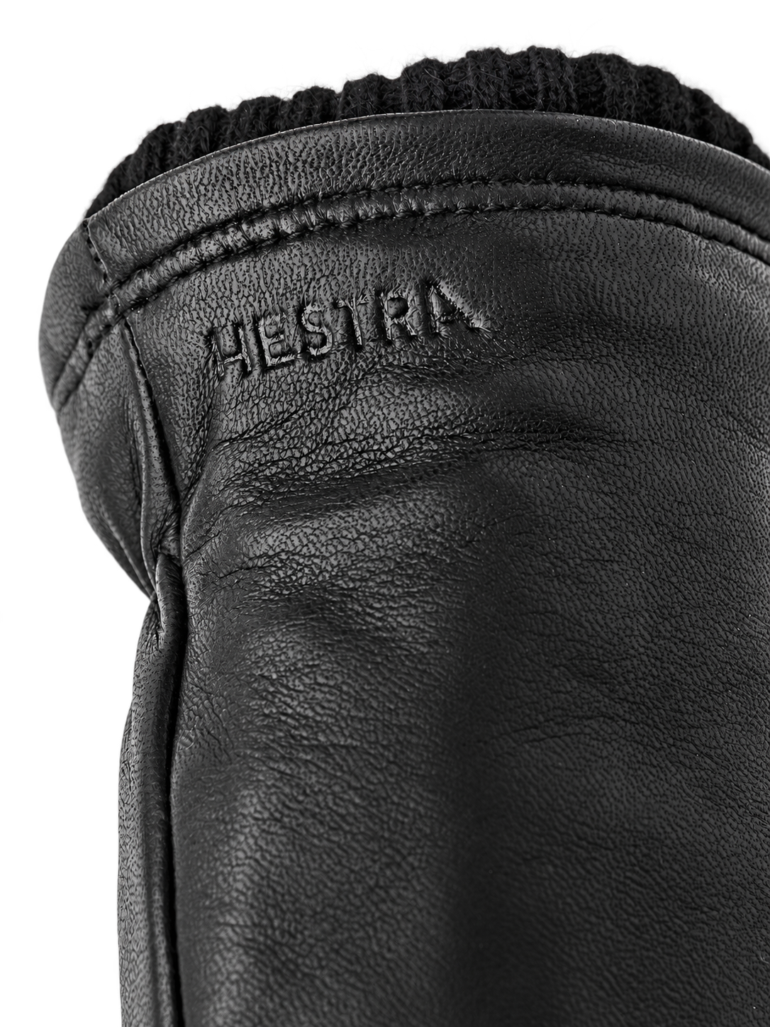 Hestra John black cuff detail, AI-edited background